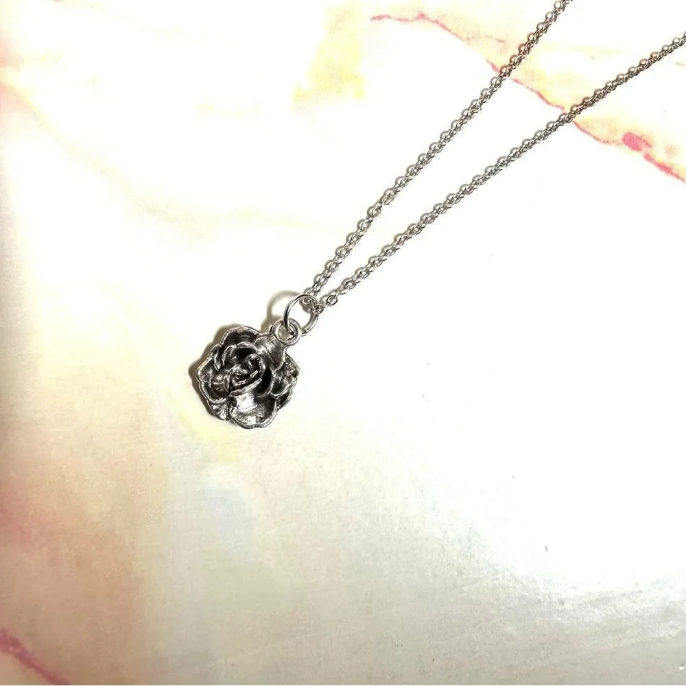 Silver tone rose pendant necklace